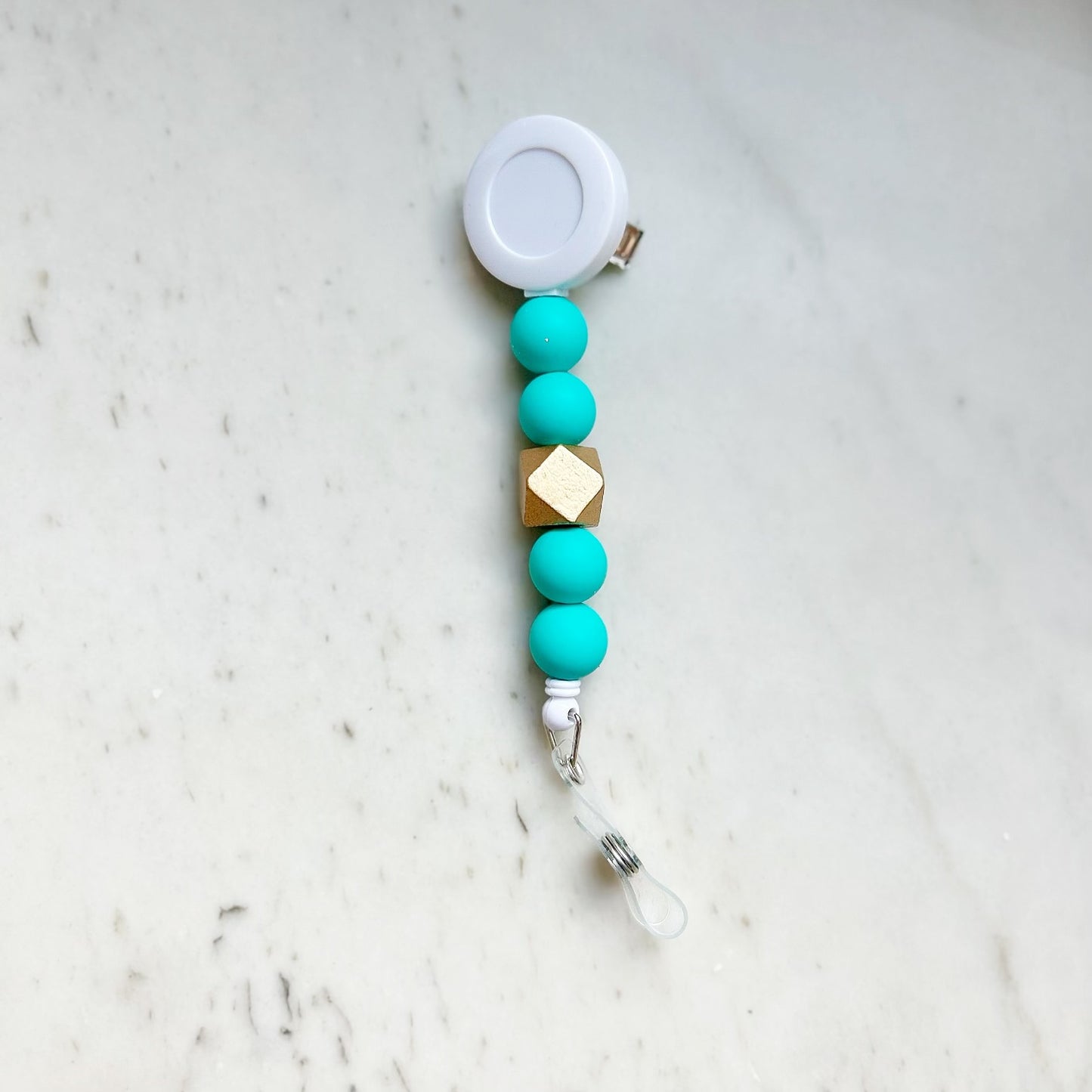 Solid Group: Turquoise Badge Reel